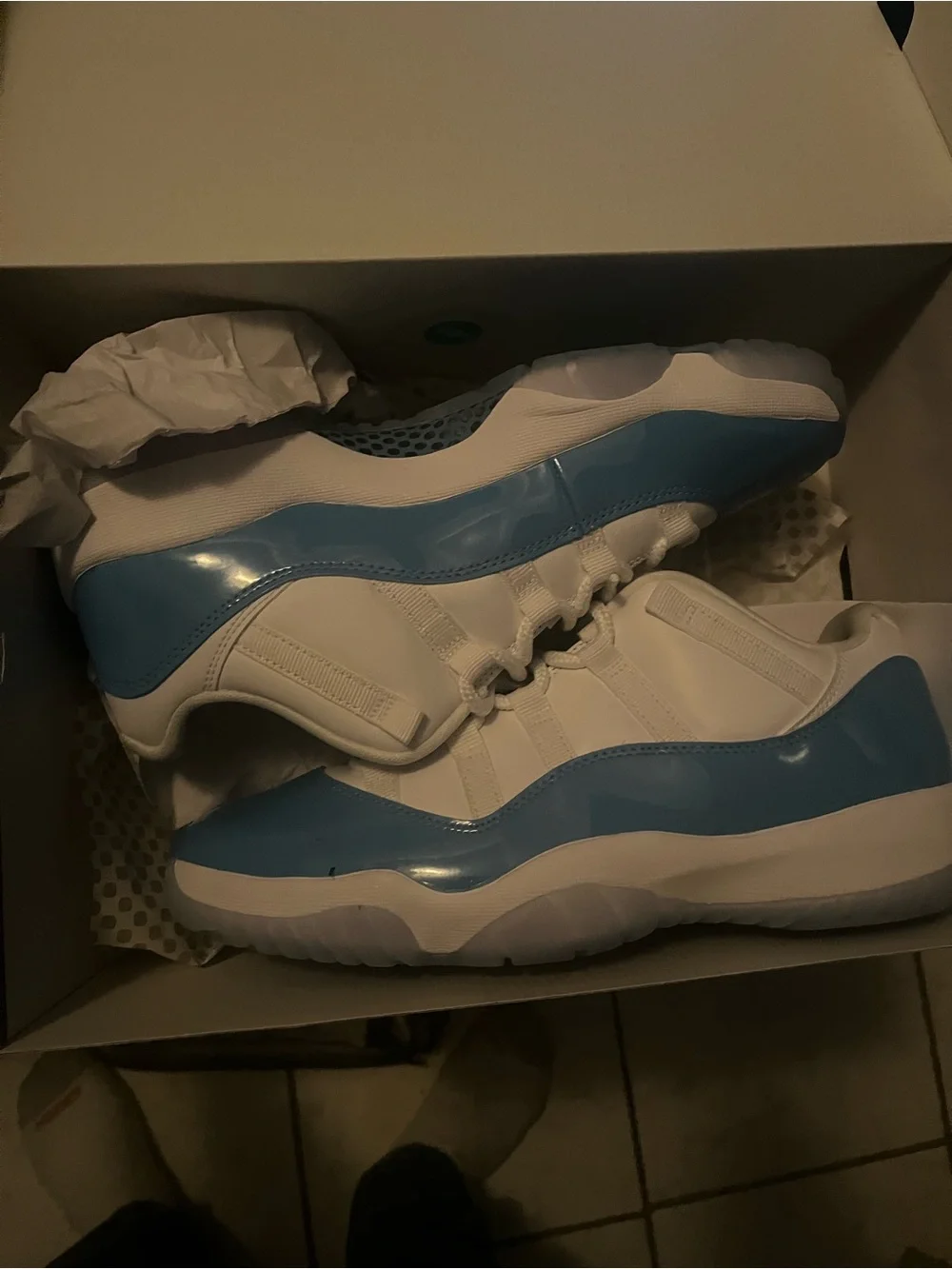 UNC Jordan 11 Low-Top Sneakers in White and Light Blue Patent